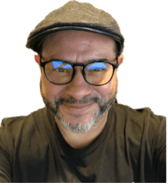 Headshot of Willy Ortiz wearing a hat and smiling